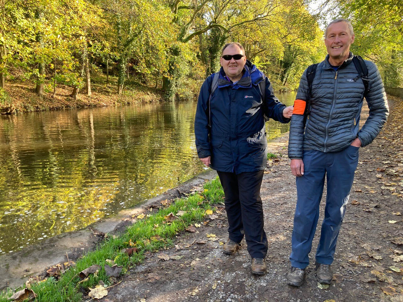 Nick, a member of the Open Country Walking Group enjoying a walk alongside one of Open Country's volunteers